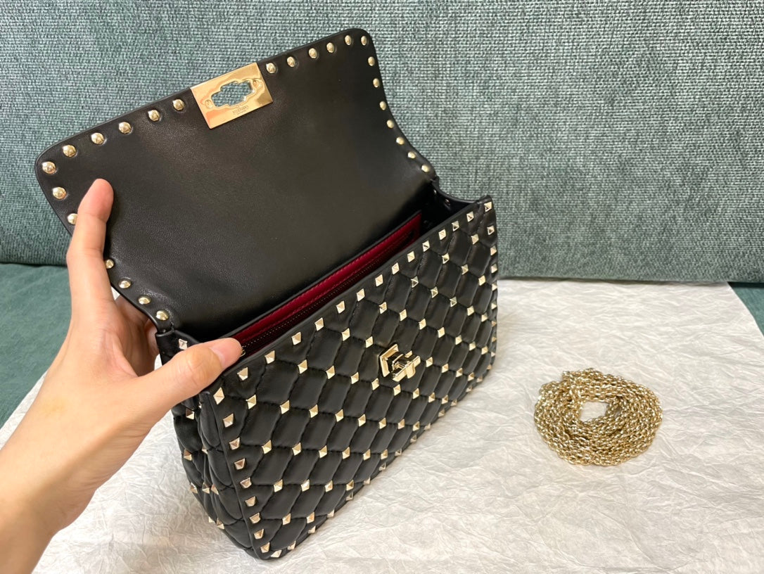 garavani rockstud spike medium 24cm black lambskin gold hardware