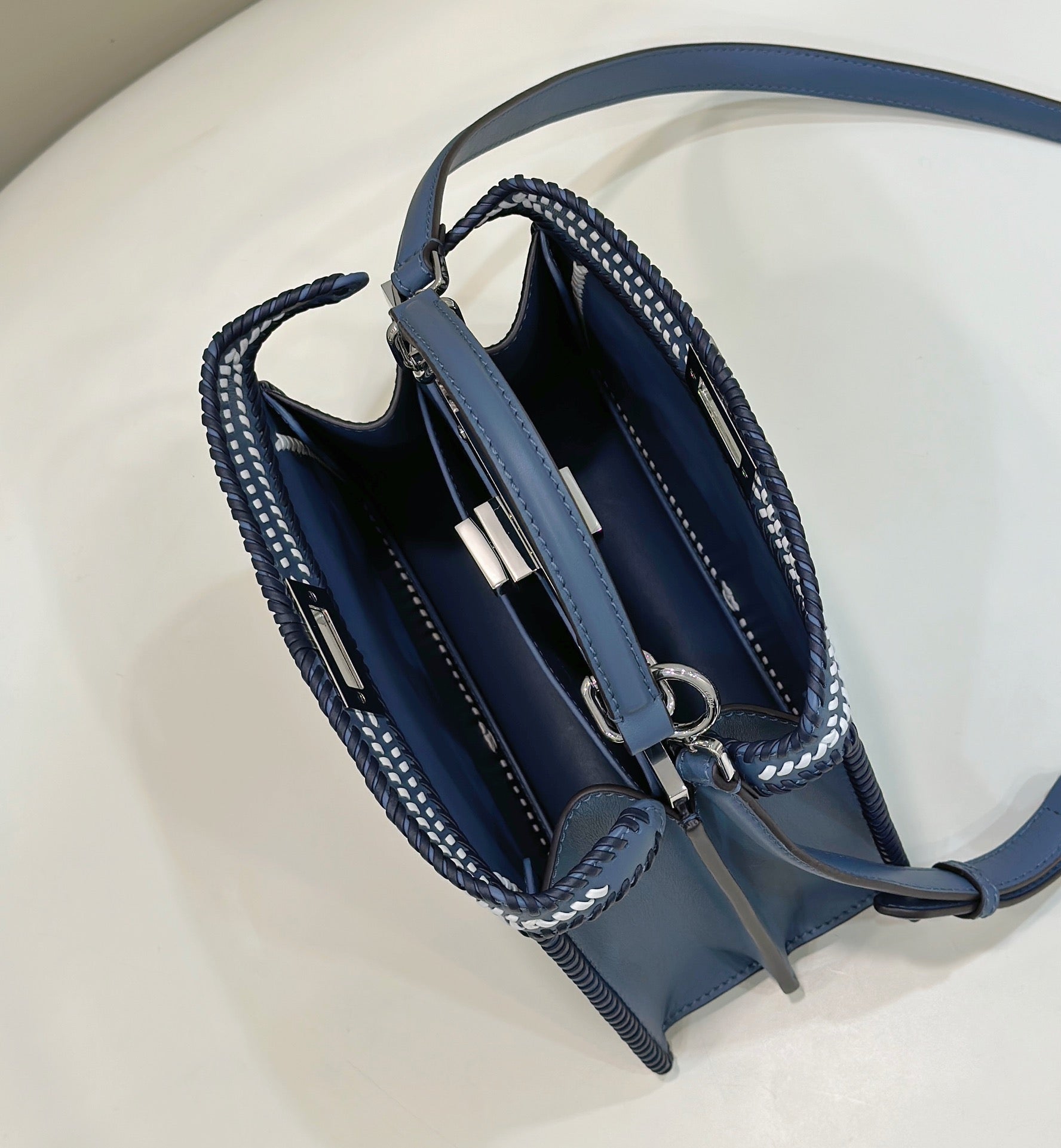 PEEKABOO ISEEU 27 IN BLUE BAYOUX INTERLACED CALFSKIN SILVER HARDWARE