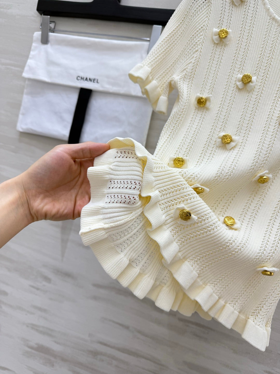 Chanel 2026 Gold Button Bow Short-sleeve Top Cream Cotton 394202