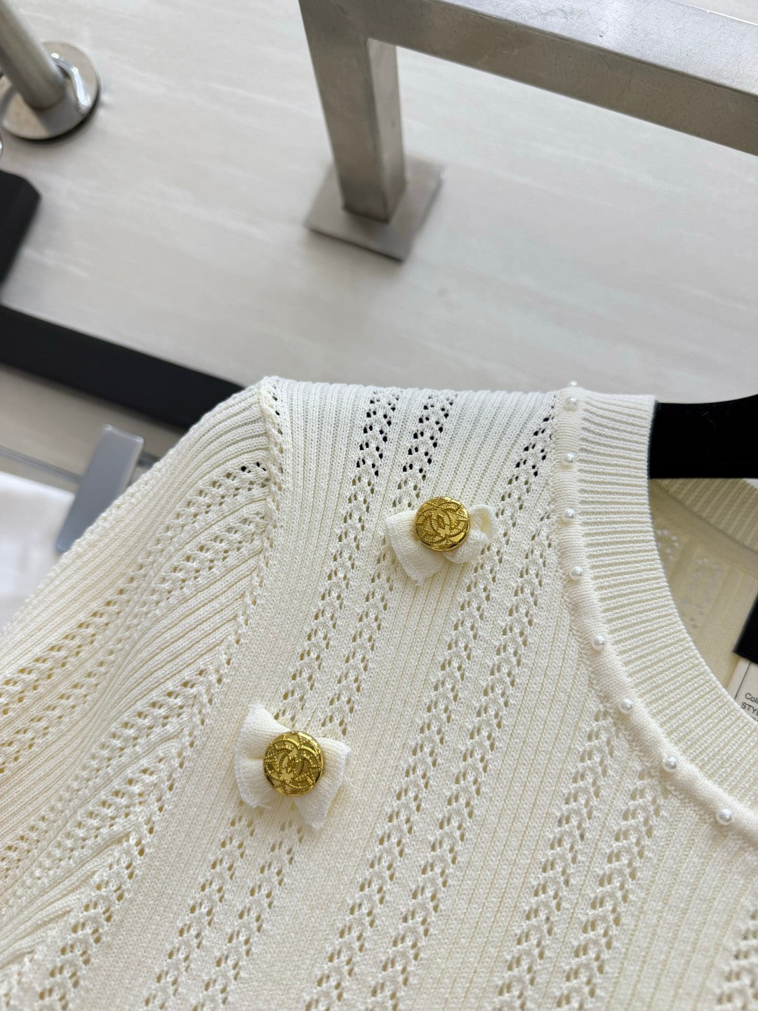 Chanel 2026 Gold Button Bow Short-sleeve Top Cream Cotton 394202