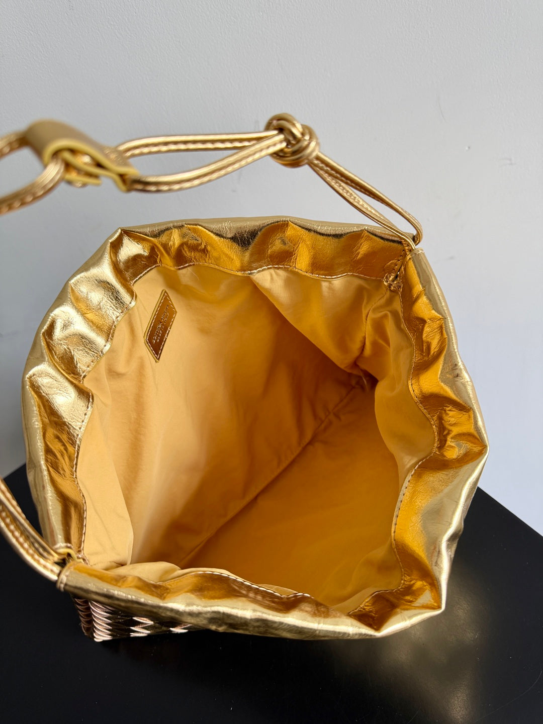 Bottega Veneta 2026 Dust Bag Gold Laminated Leather