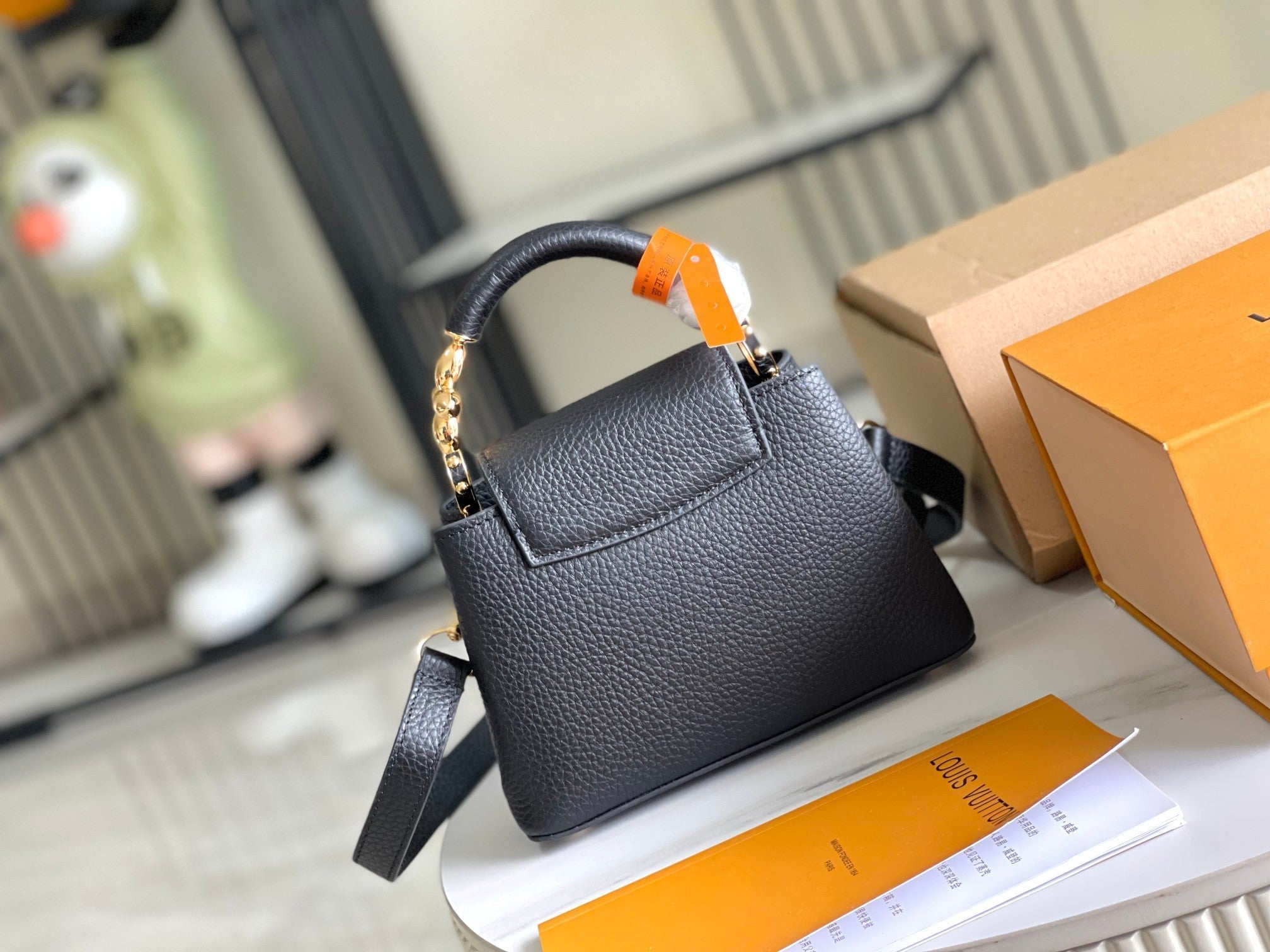 CAPUCINES MINI 21 BLACK TAURILLON GOLD HARDWARE