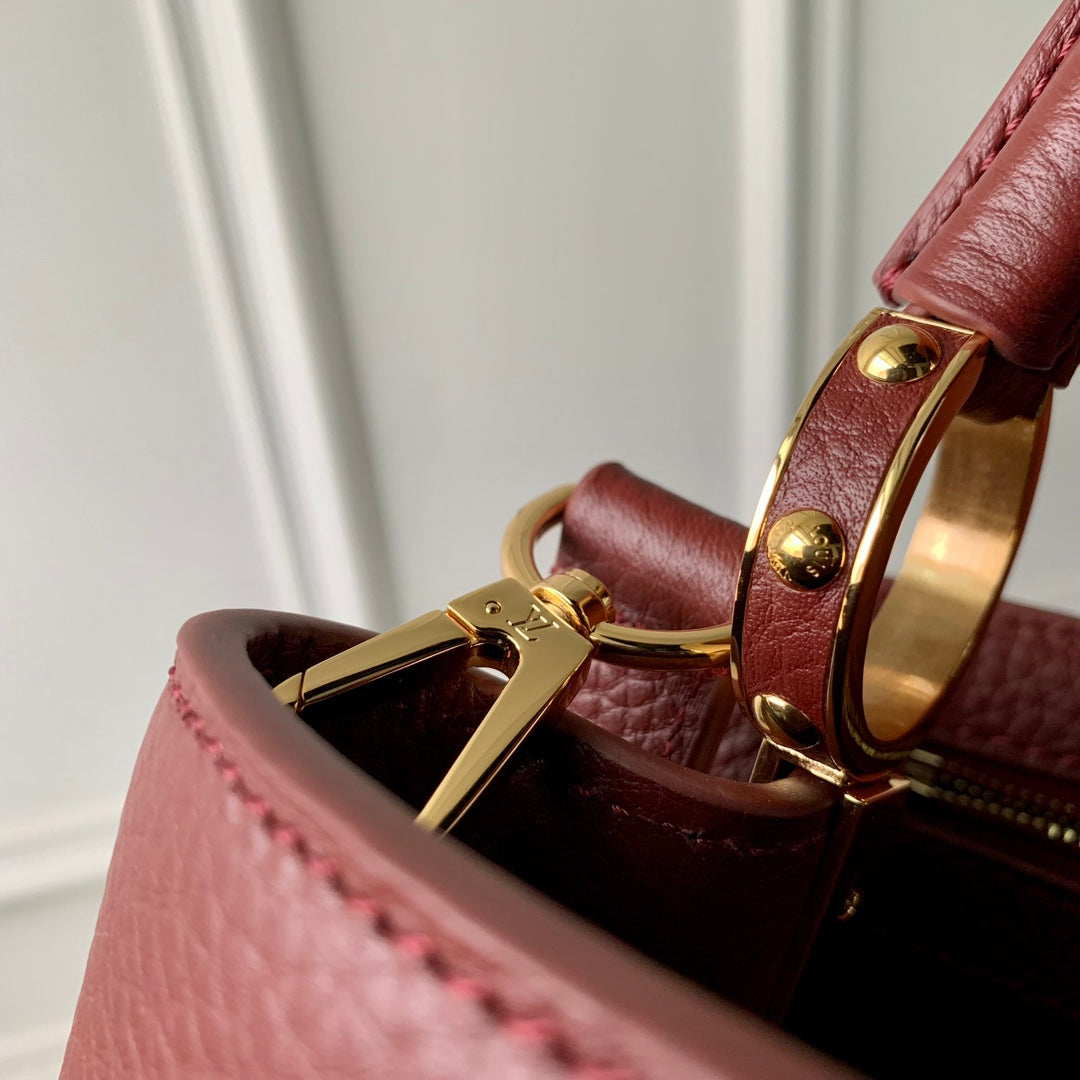 CAPUCINES MINI 21 BURGUNDY TAURILLON GOLD HARDWARE